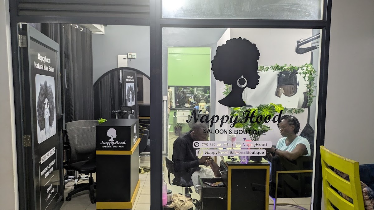 Nappyhood Salon and Boutique in Nyabugogo — a typical Kigali establishment where multiple international chargers plug into the same outlet types daily